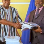 President Mahama (left) in a handshake with Attorney General, Dr. Dominic Stone during the handing over of ORAL files to the AG's Office.