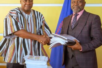 President Mahama (left) in a handshake with Attorney General, Dr. Dominic Stone during the handing over of ORAL files to the AG's Office.
