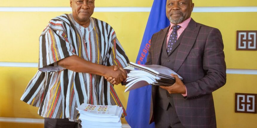President Mahama (left) in a handshake with Attorney General, Dr. Dominic Stone during the handing over of ORAL files to the AG's Office.